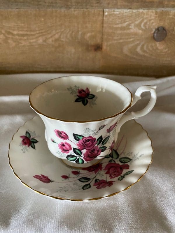 Royal Albert Montrose shape tea cup and saucer deep pink roses gold detail