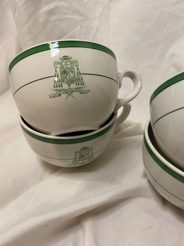 Royal Doulton Tea Cups White and Green with Crest on Front close two of four