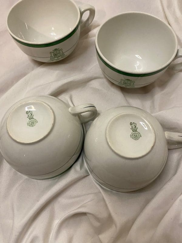 Royal Doulton Tea Cups White and Green with Crest on Front tops and bottom