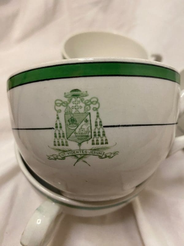 Royal Doulton Tea Cups White and Green with Crest on Front close to show crest