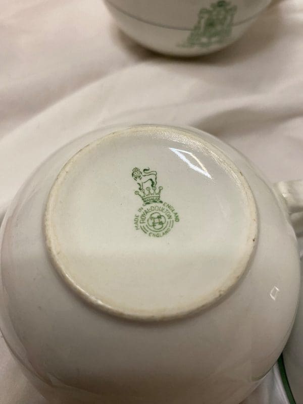 Royal Doulton Tea Cups White and Green with Crest on Front bottom makers stamp