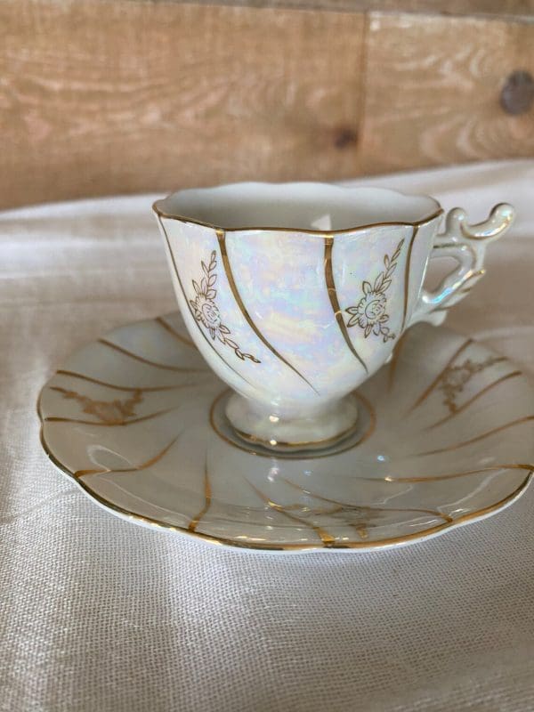 demitasse tea cups close white and gold