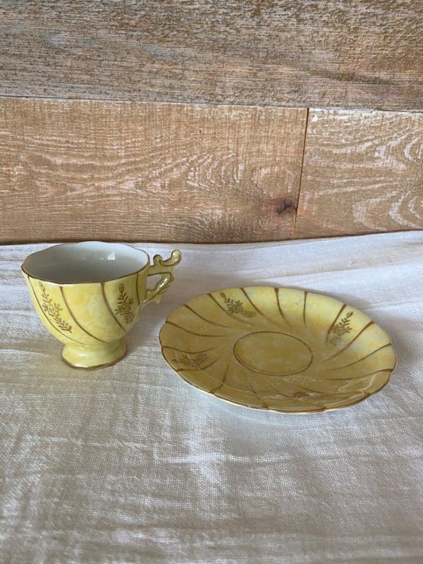 demitasse tea cups and saucers beside each other