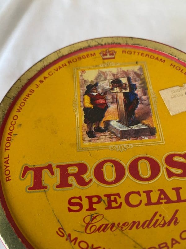 tobacco tins vintage Troost Special Cavendish round can to litho of man in guillotine