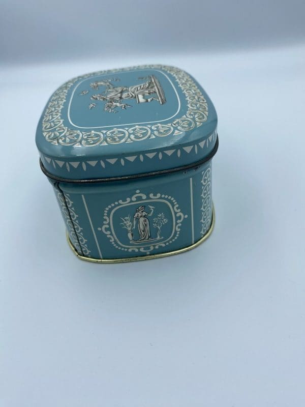 vintage candy tin Greek embossed design side