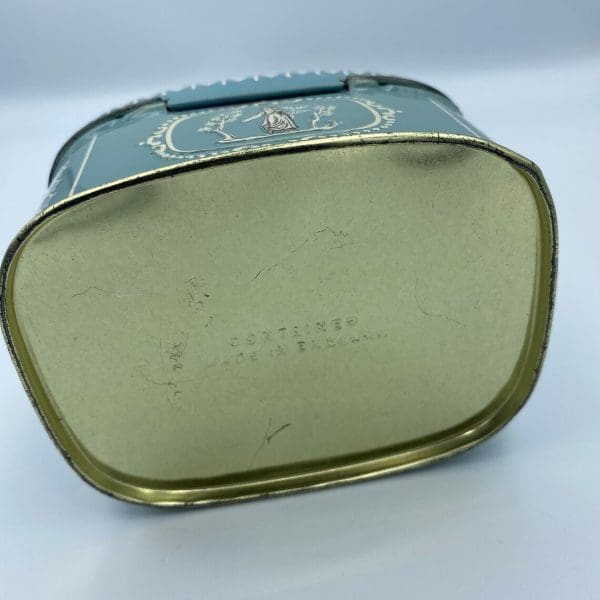 vintage candy tin Greek embossed design bottom