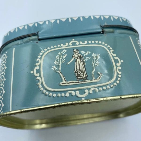 vintage candy tin Greek embossed design back side