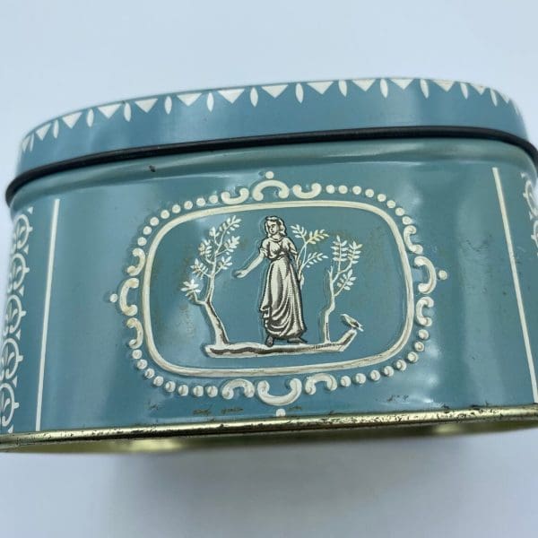 vintage candy tin Greek embossed design close front