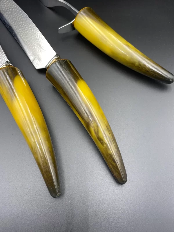 Bakelite carving set close to handles