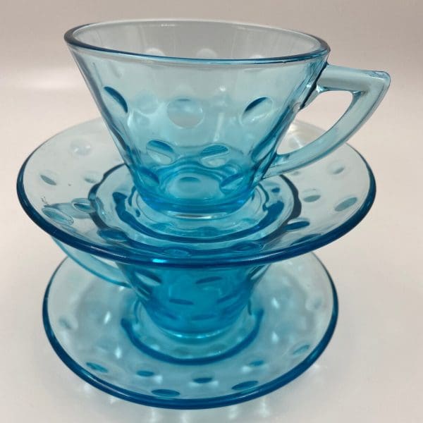 blue glass tea cups with saucers dots design