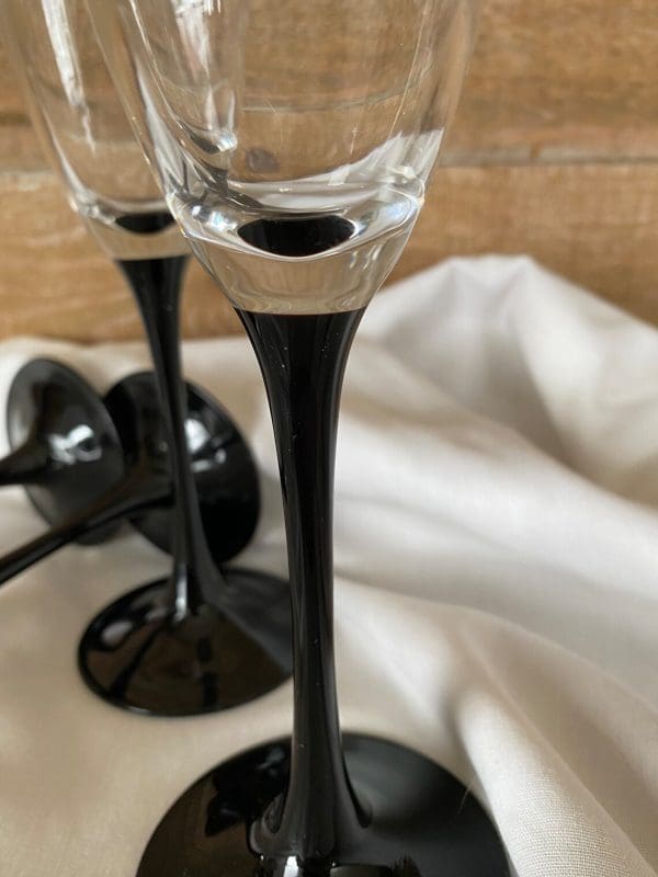 Luminarc champagne flutes close where black meets clear glass