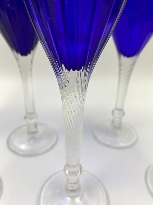 cobalt blue wine glasses close to clear twisted stems