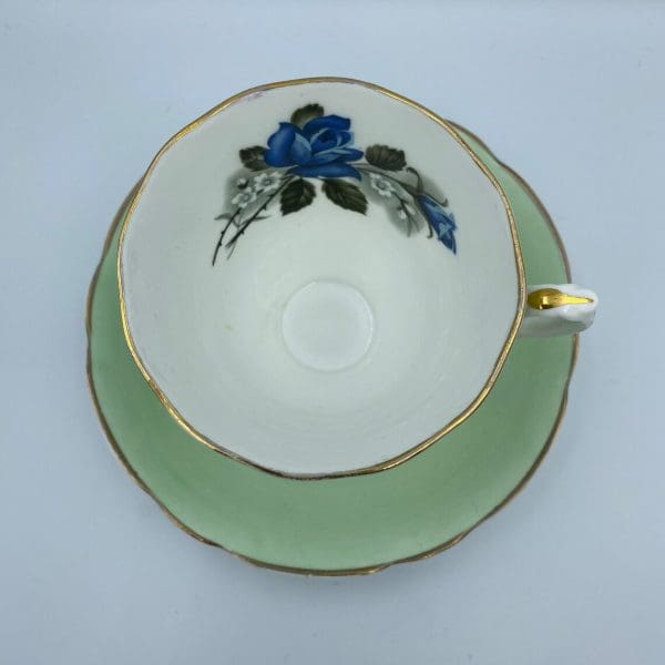 Consort teacup light green with Blue Rose inside top view