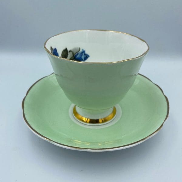 Consort teacup light green with Blue Rose inside gold trim