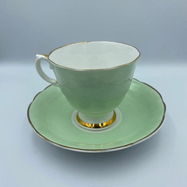 Consort teacup light green with Blue Rose inside back left side