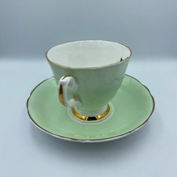 Consort teacup light green with Blue Rose inside handle