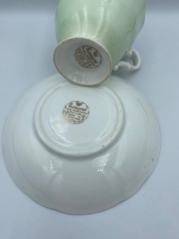 Consort teacup light green with Blue Rose inside bottom