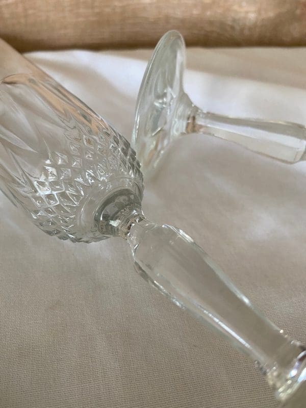 cut glass champagne flutes close to show detail