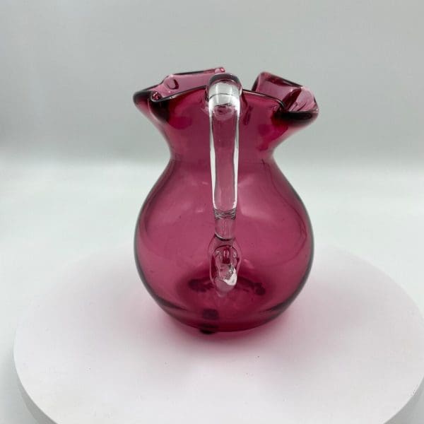 vintage pink glass pitcher with clear glass handle