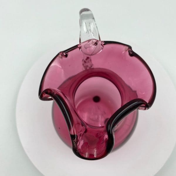 vintage pink glass pitcher top view