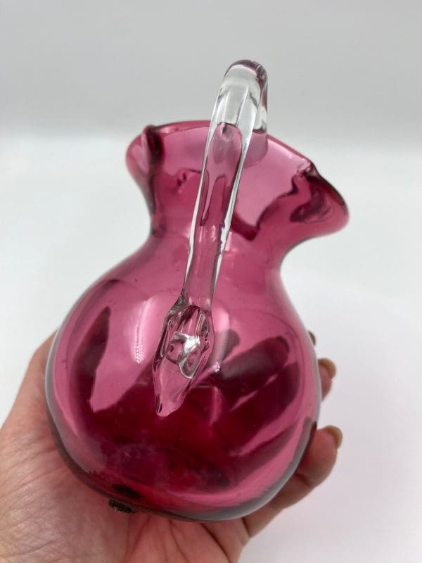 vintage pink glass pitcher in hand