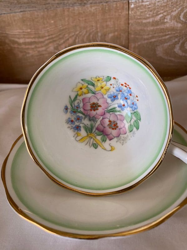 Royal Albert teacup and saucer green white with flowers tea cup on side