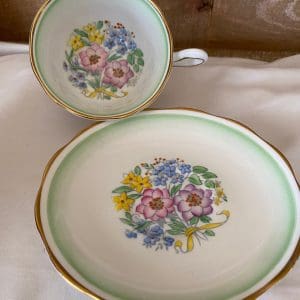 Royal Albert teacup and saucer green white with flowers gold trim