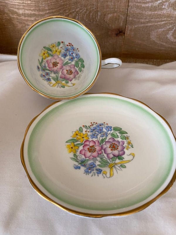 Royal Albert teacup and saucer green white with flowers gold trim