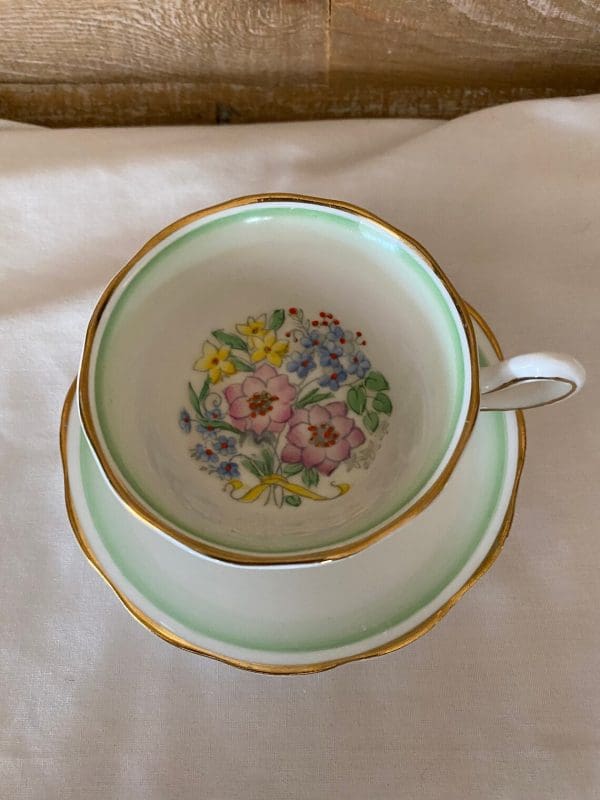 Royal Albert teacup and saucer green white with flowers top view